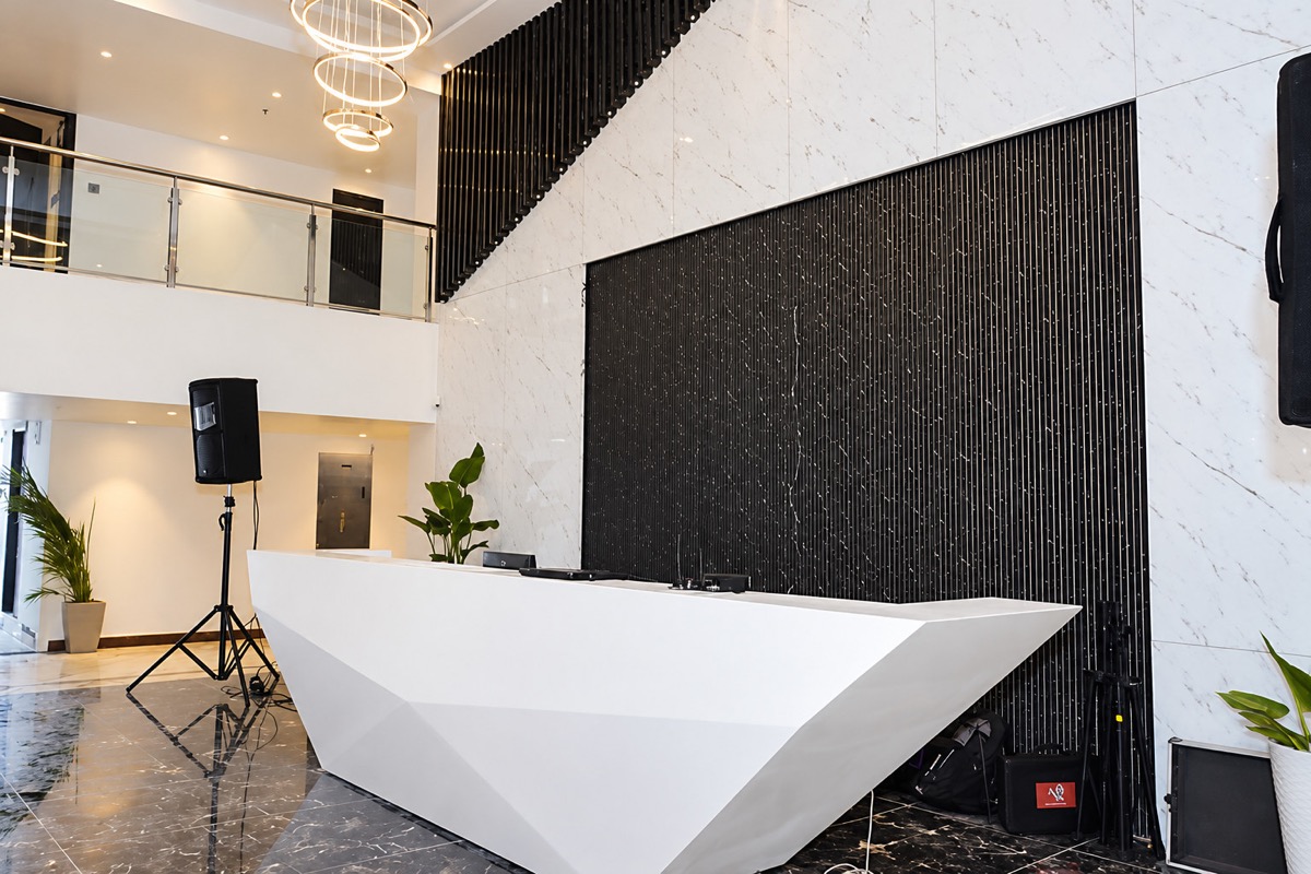 Double-height marble lobby and reception at Sekaran Residency, Perumbakkam