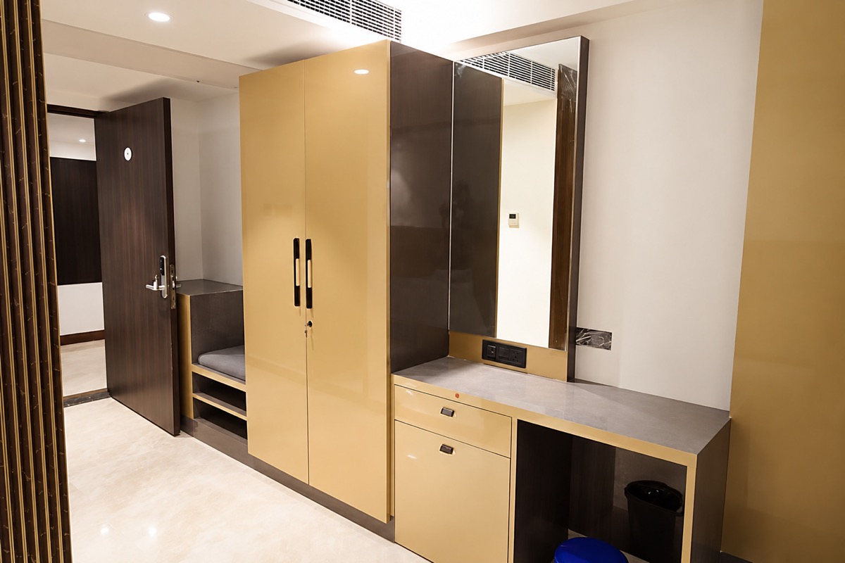 Wardrobe and vanity nook in a guest room at Sekaran Residency